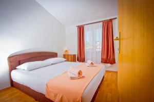 Postel nebo postele na pokoji v ubytování Apartment Mara