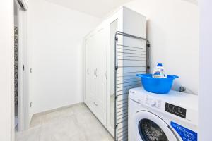 a laundry room with a washer and dryer at Lucia's Apartments in Ischia Town +23 photos