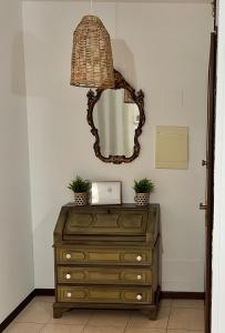 a mirror on top of a dresser in a room at Iris in Montecchio Maggiore