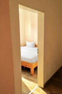 a door leading into a bedroom with a bed at Hotel Sickinger Hof in Berlin