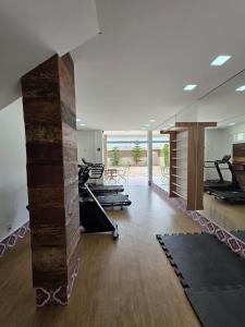 a gym with treadmills and exercise equipment in a room at Hotel Estilo de Minas in Diamantina +75 photos