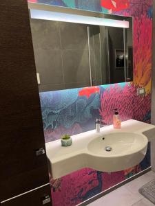 a bathroom with a sink and a mirror at COSENZA APARTMENT in Cosenza +16 photos