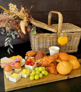 a tray of food with eggs and bread and fruit at BelleLiv in Nijlen