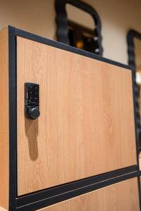 a close up of a wooden door with a latch at Chania Capsule Stay in Chania +22 photos