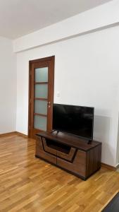 a living room with a flat screen tv on a table at Rest apartment Niksic in Nikšić