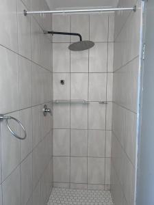 a shower with a glass door in a bathroom at Ocean Haven in Walvis Bay