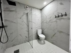 a bathroom with a shower and a toilet at Vahtralehe majutus in Tartu