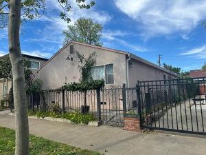 a house with a wrought iron fence in front of it at Downtown Private Master Suite in Sacramento