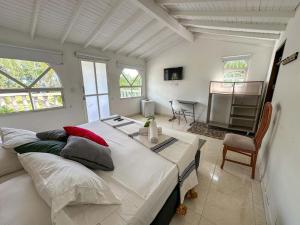 a bedroom with a large bed in a room at Amara Hotel in Doradal