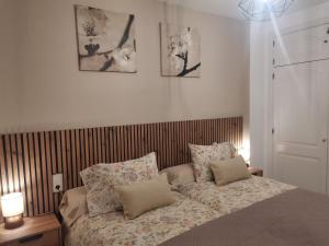a bedroom with a bed with pillows on it at Mi Capricho in Sitio de Calahonda +59 photos