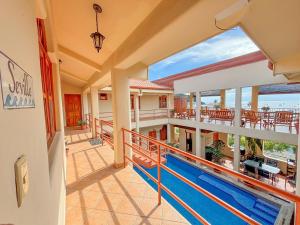 an image of a house with a swimming pool at Seville Suite in San Juan del Sur
