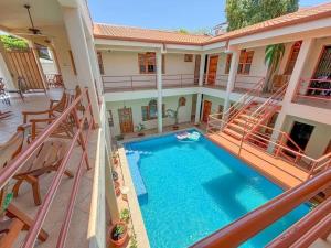 an overhead view of a house with a swimming pool at Seville Suite in San Juan del Sur