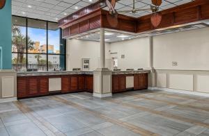 an empty room with a large room with a large window at Landmark Resort in Myrtle Beach