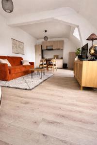 a living room with a couch and a table at Appartement Centre ville Le blanc in Le Blanc +16 photos
