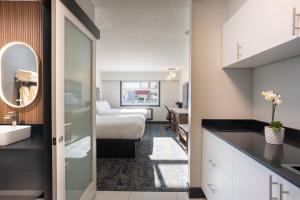 a hotel room with a bed and a bathroom at Inn The Mountains, an Ascend Collection Hotel in Hope +113 photos