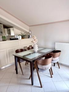 a dining room with a glass table and chairs at Valeria's Apartment in Argostoli