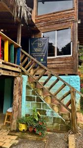 a sign on the side of a building at Casa Aurea in Medellín +1 photo