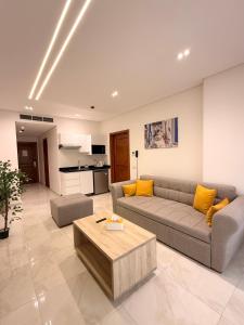 a living room with a couch and a table at Zones Residence Maadi in Cairo