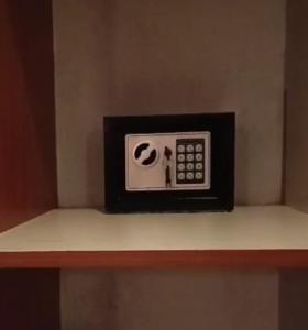 a microwave sitting on top of a shelf at Catwalk Factory Apartment in Ukunda