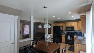 a kitchen and dining room with a table and a dining room at Central Mountain Retreat - Sleeps 7! in Logan