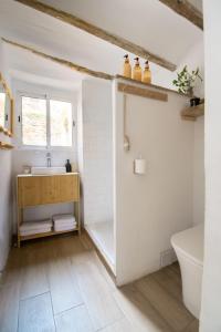 a bathroom with a sink and a tub and a toilet at Calderona Tiny house in Segorbe +16 photos