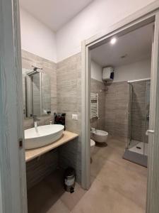 a bathroom with a sink and a toilet at La Locanda del Giardino in Lentate sul Seveso