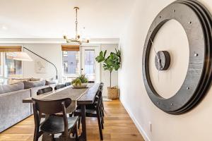 a dining room with a table and chairs and a mirror at Inspired Elegance at Tamarack Lodge in Canmore +110 photos
