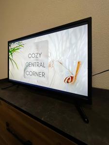 a flat screen tv sitting on top of a dresser at Cozy Central Corner in Gjakove