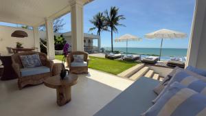 a living room with a view of the ocean at Casa Praia Parati in Anchieta