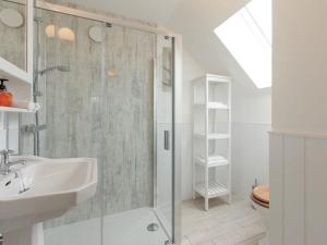 a bathroom with a shower and a sink at Millbank in Ballindalloch +30 photos