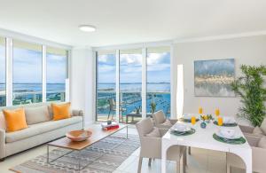 a living room with a couch and a table at Private Oasis at Arya in Miami
