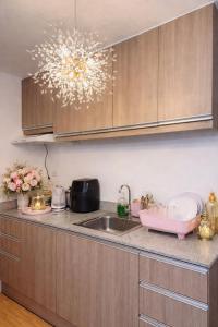 a kitchen with a sink and a counter top at Super Cozy Condo Davao in Davao City