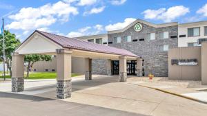 a building with a pavilion in front of it at Crossroads Hotel and Huron Event Center in Huron