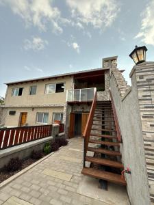 a house with a staircase in front of it at Don Isidro in Miramar