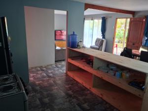 a kitchen with a counter top in a room at hare tamahei in Isla de Pascua