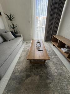 a living room with a couch and a coffee table at Comfortable 2BR Condo pool & gym in Tulum