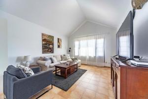 a living room with a couch and a tv at Luxury House Sofie in Tías