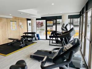 a gym with treadmills and elliptical machines at THE COSMOPOLITAN COTTON TREE Unit 10207 Cotton Tree in Maroochydore