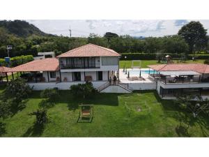an aerial view of a house with a yard at Finca Villa AlCon - Hostel in Pereira