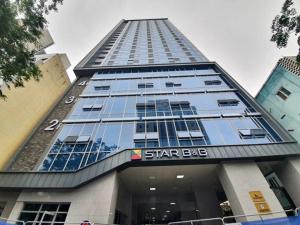 a tall building with a star bite sign on it at 대구 동성로 스타비앤비 in Hyomoktong-Ilgu