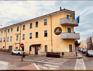 a building with a clock on the side of it at Hotel Colosseo Colleferro in Colleferro