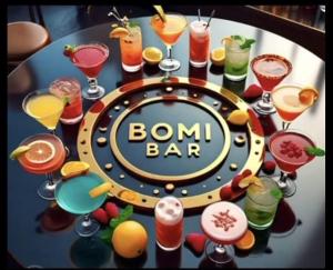 a round table with a bunch of drinks on it at Bomi Bar in King Faro