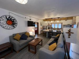 a living room with two couches and a kitchen at Hotel Mi Pueblito Tapalpa in Tapalpa +110 photos