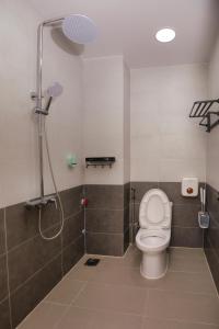a bathroom with a shower and a toilet in it at Central Phu Quoc Villa in Phú Quốc +8 photos