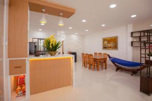 a kitchen and dining room with a table and chairs at Central Phu Quoc Villa in Phú Quốc