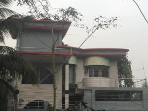 a building with a tree in front of it at Shanti villa in Kadipur +7 photos