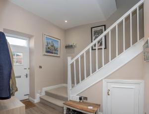 a staircase in a home with white walls at St Margarets Mews in Durham