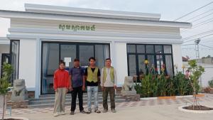 a group of men standing in front of a building at Good Dream Guest Home in Phumĭ Toch +4 photos