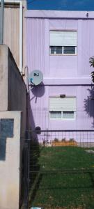 a surfboard on the side of a building at El Jacaranda in Carmen de Patagones