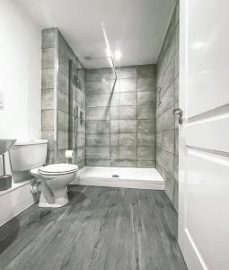 a bathroom with a toilet and a shower at 7 The Cathedrals in Durham